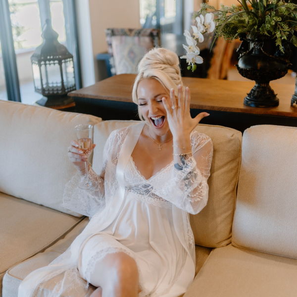 la hacienda snow hill bride getting ready champagne toast white lace robe