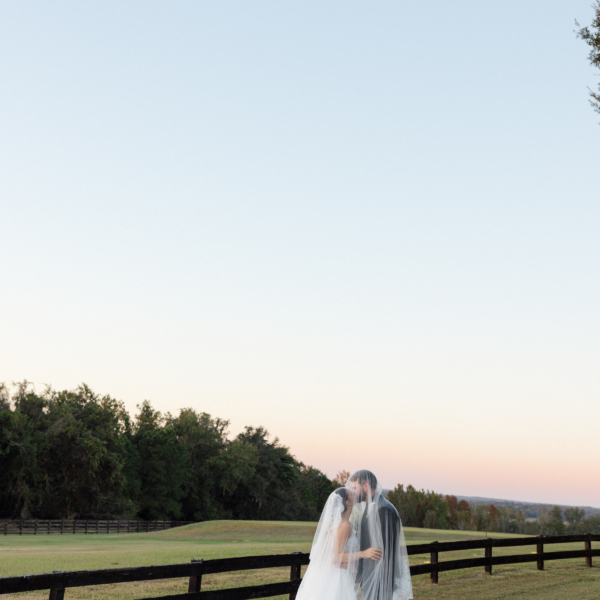 la hacienda snow hill bride groom sunset pasture fence veil