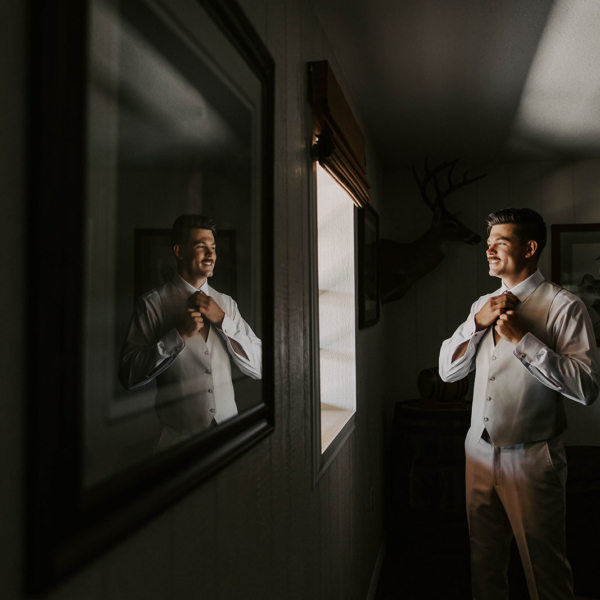 la hacienda snow hill groom getting ready mirror reflection wedding