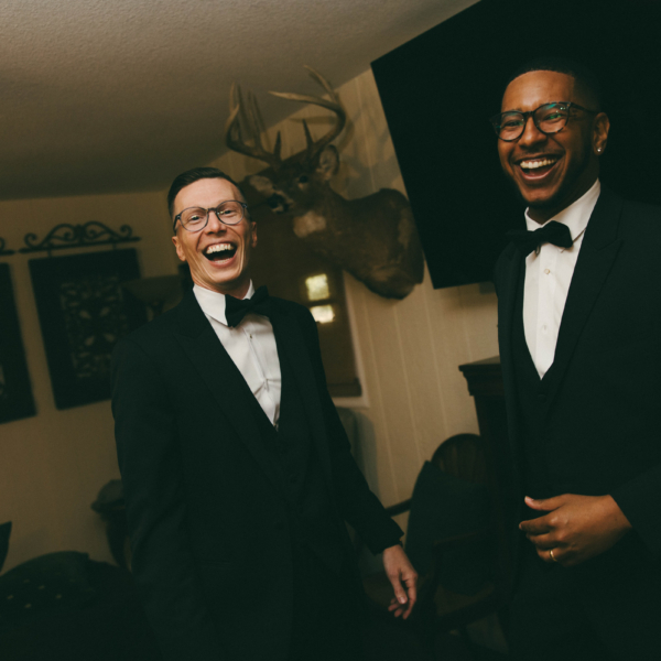 la hacienda snow hill groom groomsmen laughing tuxedos wedding