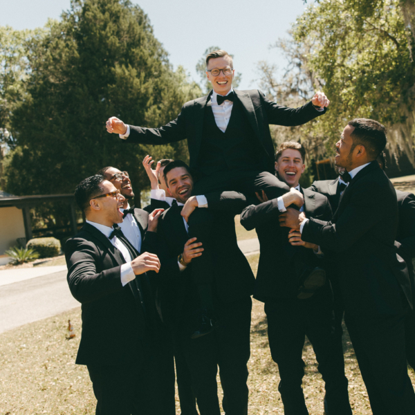 la hacienda snow hill groomsmen lifting groom celebration wedding photo