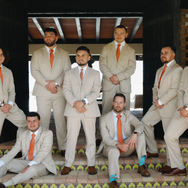 la hacienda snow hill groomsmen tan suits orange ties wedding party