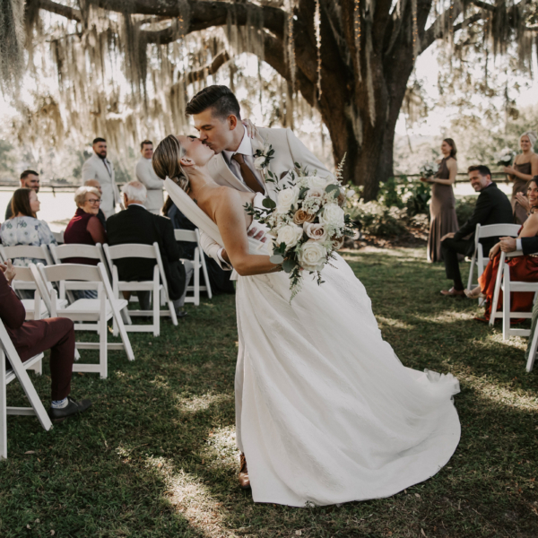 la hacienda snow hill outdoor wedding ceremony kiss spanish moss