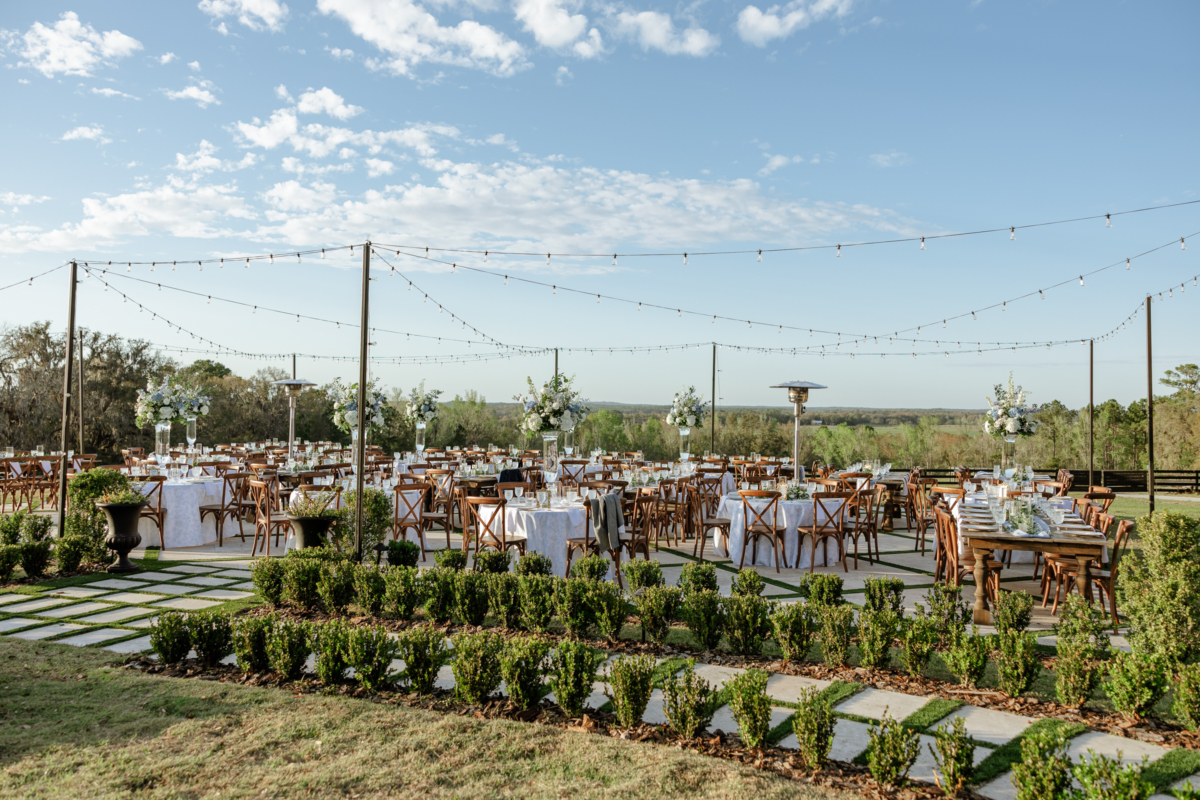 la hacienda snow hill outdoor wedding reception bistro lights rustic tables