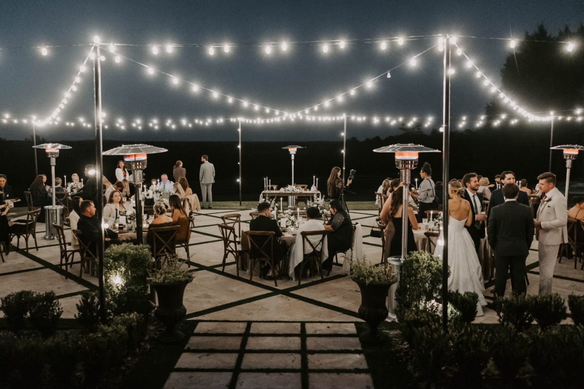 la hacienda snow hill outdoor wedding reception string lights evening