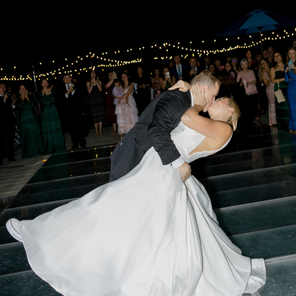 la hacienda snow hill romantic wedding kiss string lights evening reception