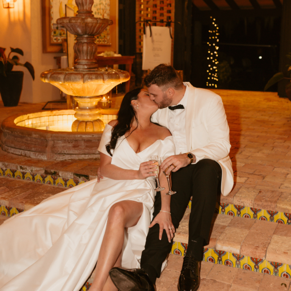 la hacienda snow hill wedding couple fountain champagne toast