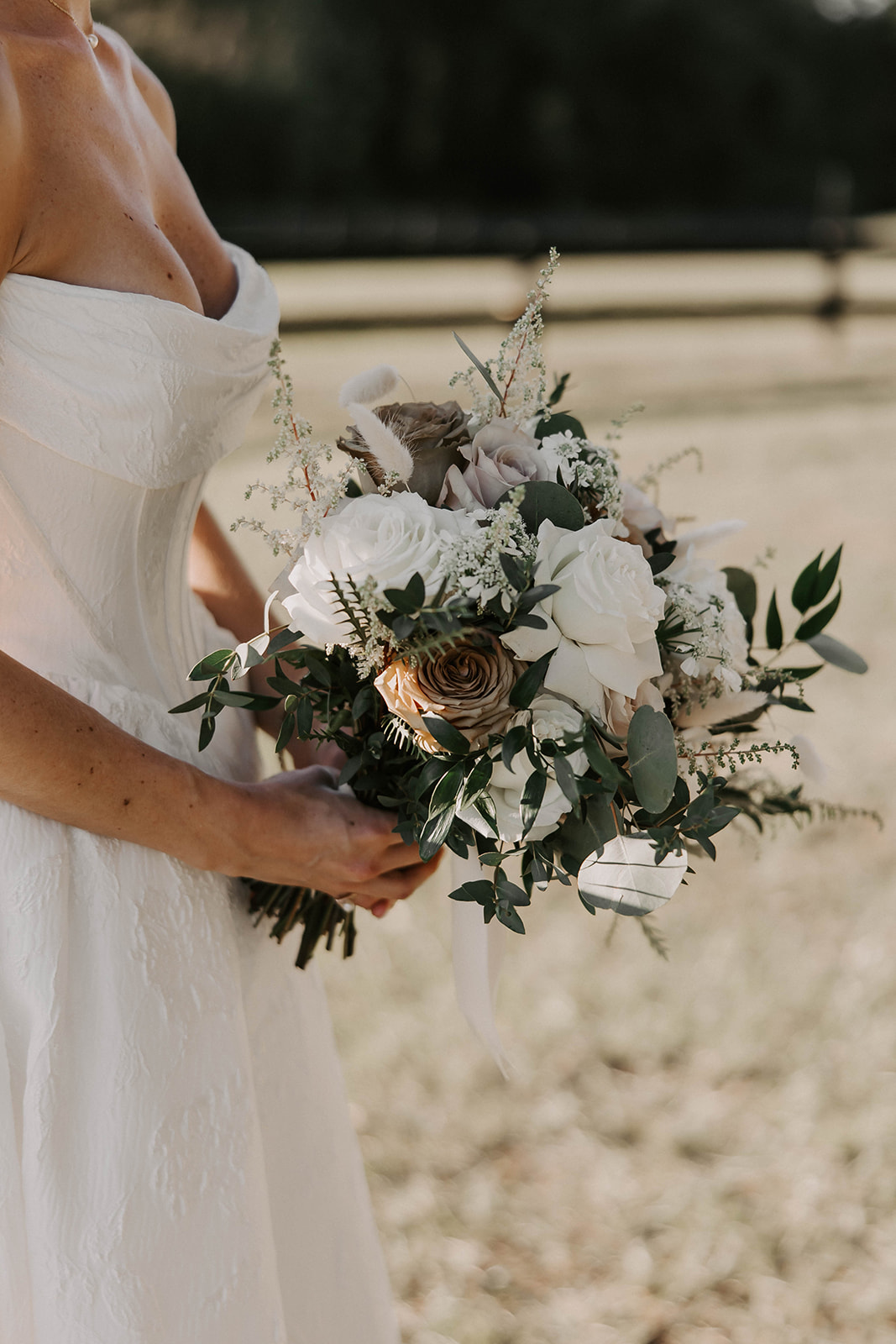 bridal bouquet white blush roses eucalyptus brooksville florida - A Fall Wedding at La Hacienda on Snow Hill in Brooksville, FL Bride holding a lush bridal bouquet of white and blush roses with eucalyptus greenery at La Hacienda on Snow Hill wedding venue in Brooksville Florida near Tampa