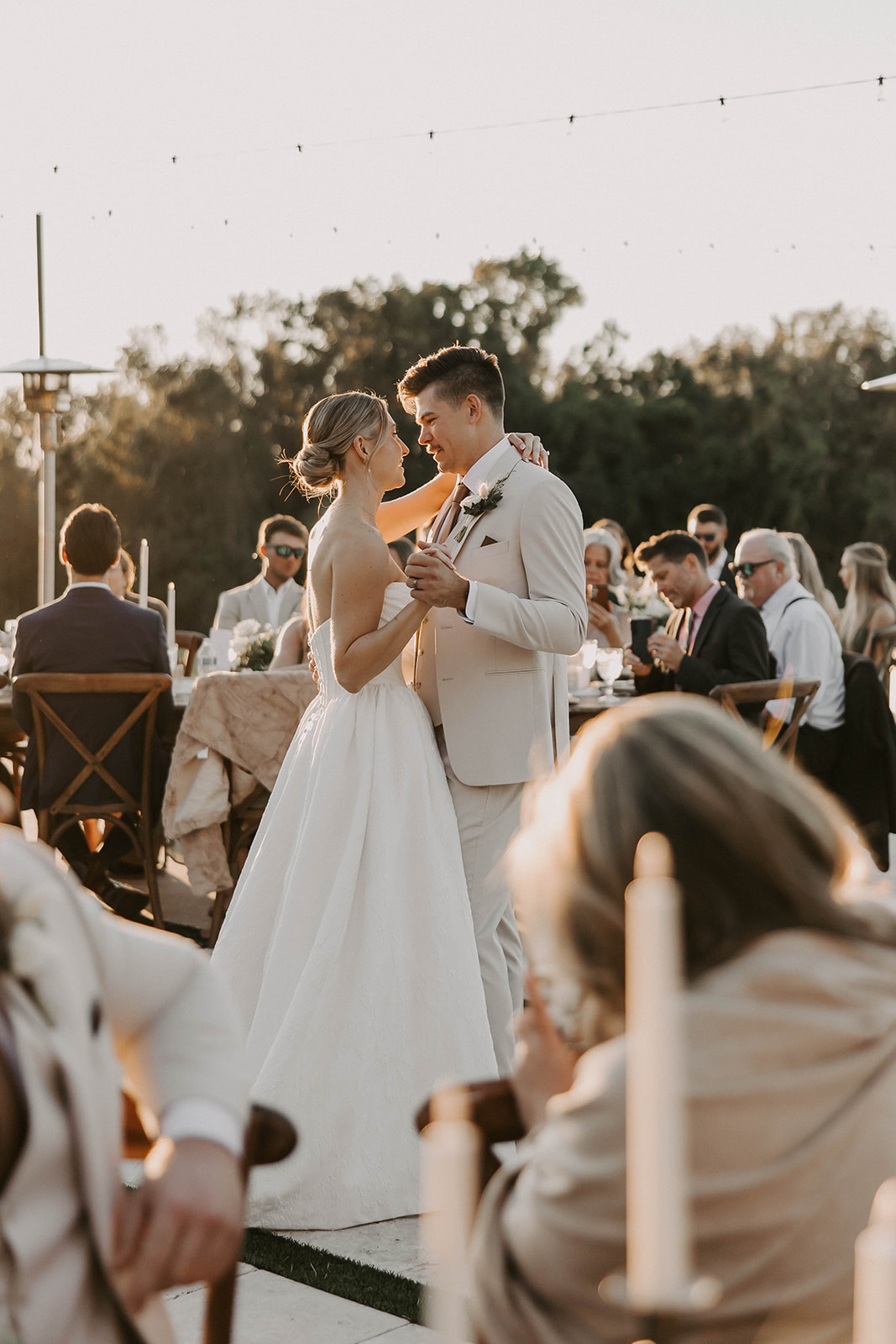 outdoor first dance wedding reception la hacienda brooksville - A Fall Wedding at La Hacienda on Snow Hill in Brooksville, FL Bride and groom share their first dance during a golden hour outdoor wedding reception at La Hacienda on Snow Hill in Brooksville Florida near Tampa