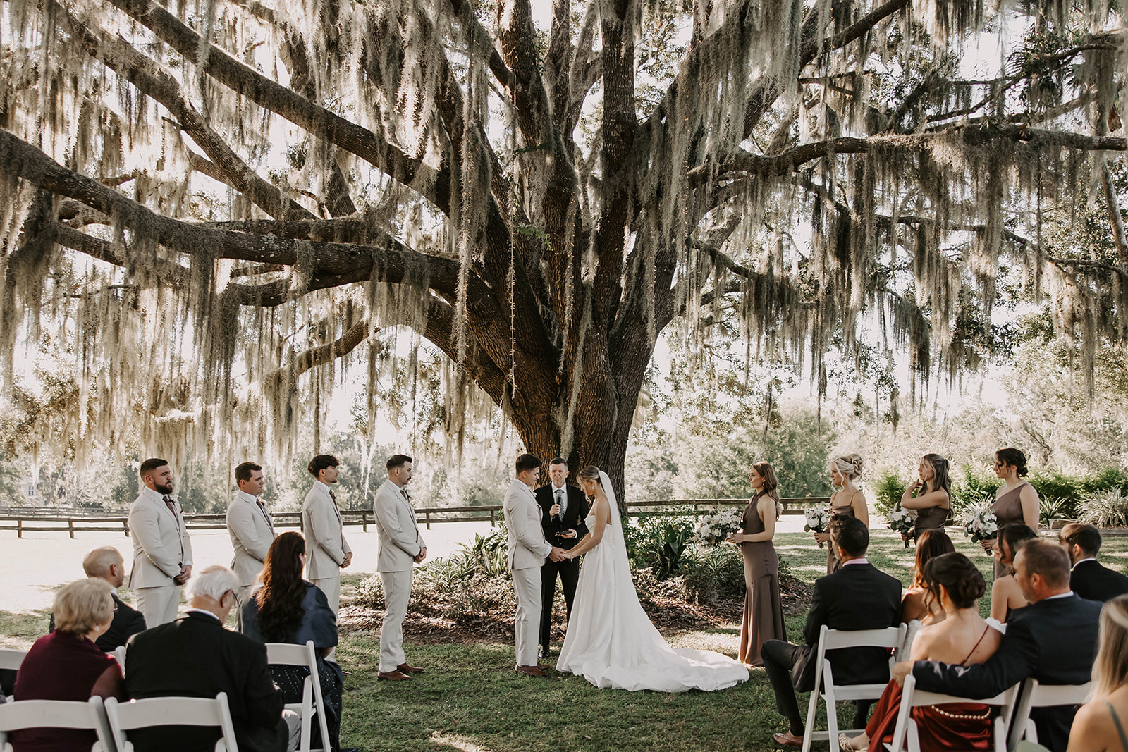 outdoor wedding ceremony live oak spanish moss brooksville florida - A Fall Wedding at La Hacienda on Snow Hill in Brooksville, FL Outdoor wedding ceremony under a massive live oak tree draped in Spanish moss at La Hacienda on Snow Hill wedding venue in Brooksville Florida near Tampa